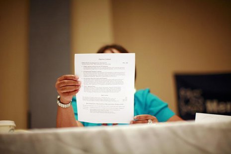 A woman looks over a resume during a job fair in New York June 11, 2012. REUTERS/Eric Thayer A woman looks over a resume during a job fair in New York June 11, 2012. REUTERS/Eric Thayer