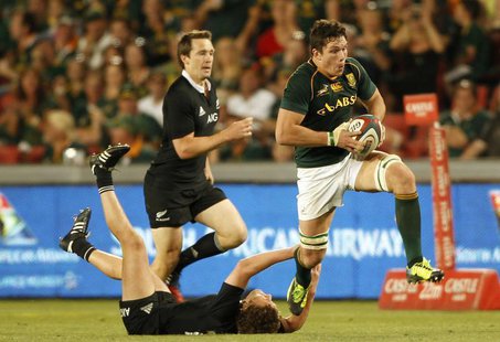 New Zealand's All Blacks Tawera Kerr-Barlow (L) tackles South Africa's Francois Louw, during the final round of the Rugby Championship at El New Zealand's All Blacks Tawera Kerr-Barlow (L) tackles South Africa's Francois Louw, during the final round of the Rugby Championship at El