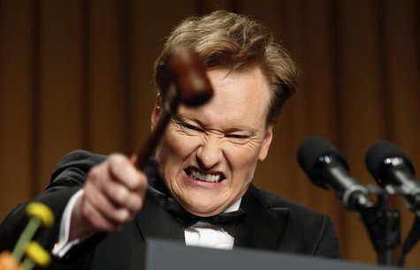 Comedian Conan O'Brien smashes a gavel as he speaks during the White House Correspondents Association Dinner in Washington April 27, 2013. R Comedian Conan O'Brien smashes a gavel as he speaks during the White House Correspondents Association Dinner in Washington April 27, 2013. R