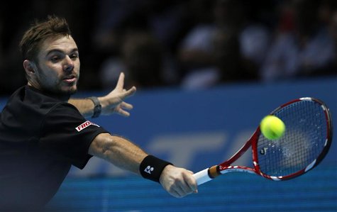 Stanislas Wawrinka of Switzerland hits a return during his men's singles tennis match against Rafael Nadal of Spain at the ATP World Tour Fi Stanislas Wawrinka of Switzerland hits a return during his men's singles tennis match against Rafael Nadal of Spain at the ATP World Tour Fi