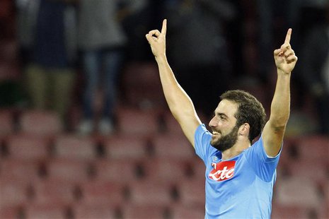 Napoli's Gonzalo Higuain celebrates after scoring against Olympique Marseille during their Champions League soccer match at San Paolo stadiu Napoli's Gonzalo Higuain celebrates after scoring against Olympique Marseille during their Champions League soccer match at San Paolo stadiu