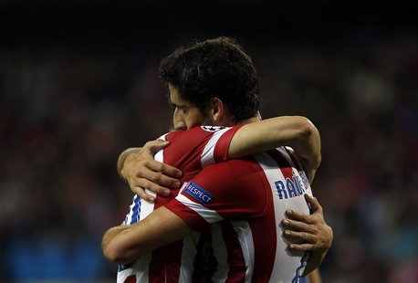 Atletico Madrid's Raul Garcia (R) celebrates scoring against Austria Vienna with teammate Juan Francisco Torres "Juanfran" during their Cham Atletico Madrid's Raul Garcia (R) celebrates scoring against Austria Vienna with teammate Juan Francisco Torres "Juanfran" during their Cham