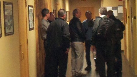 Enbridge and Kalamazoo County Officials huddle in the hallway between meetings as the County Board weighs the proposal to turn a county park into a temporary contaminated waste transfer station. Enbridge and Kalamazoo County Officials huddle in the hallway between meetings as the County Board weighs the proposal to turn a county park into a temporary contaminated waste transfer station.