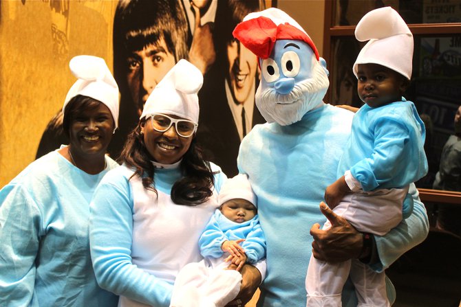 James Jones and family as Smurfs on Halloween