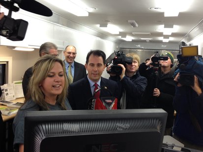 Governor Scott Walker views how he did after using the welding simulation booth inside LTC's Advanced Manufacturing Mobile Lab while in Sheboygan. Governor Scott Walker views how he did after using the welding simulation booth inside LTC's Advanced Manufacturing Mobile Lab while in Sheboygan.