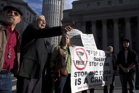 People hold signs protesting against the Stop-and-Frisk program, at a news conference outside the Federal Court in New York November 1, 2013 People hold signs protesting against the Stop-and-Frisk program, at a news conference outside the Federal Court in New York November 1, 2013