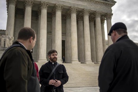 Christian clergy members gather outside the U.S. Supreme Court as it hears arguments in the case of Town of Greece, NY v. Galloway, in Washi Christian clergy members gather outside the U.S. Supreme Court as it hears arguments in the case of Town of Greece, NY v. Galloway, in Washi