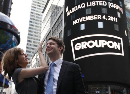 Groupon Chief Executive Andrew Mason poses with his newly married wife, pop musician Jenny Gillespie, outside the Nasdaq Market following hi Groupon Chief Executive Andrew Mason poses with his newly married wife, pop musician Jenny Gillespie, outside the Nasdaq Market following hi