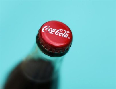 A bottle of Coca-Cola is shown in this photo illustration in Encinitas, California October 10, 2013. The Coca-Cola Company will report 3rd q A bottle of Coca-Cola is shown in this photo illustration in Encinitas, California October 10, 2013. The Coca-Cola Company will report 3rd q