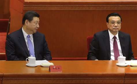 China's President Xi Jinping (L) looks at Premier Li Keqiang as they attend the opening ceremony of the 11th National Women's Congress at th China's President Xi Jinping (L) looks at Premier Li Keqiang as they attend the opening ceremony of the 11th National Women's Congress at th