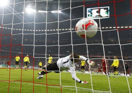 Borussia Dortmund's goalkeeper Roman Weidenfeller receives a goal by Bayern Munich's Arjen Robben during their German soccer cup, DFB Pokal, Borussia Dortmund's goalkeeper Roman Weidenfeller receives a goal by Bayern Munich's Arjen Robben during their German soccer cup, DFB Pokal,