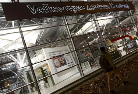 A woman passes a shop-window of German carmaker Volkswagen at a VW dealership in Hamburg, October 28, 2013. REUTERS/Fabian Bimmer A woman passes a shop-window of German carmaker Volkswagen at a VW dealership in Hamburg, October 28, 2013. REUTERS/Fabian Bimmer