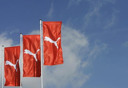 Flages wave over the Puma factory outlet store in Herzogenaurach near Nuremberg April 10, 2007. REUTERS/Michaela Rehle (GERMANY) - RTR1OHKA Flages wave over the Puma factory outlet store in Herzogenaurach near Nuremberg April 10, 2007. REUTERS/Michaela Rehle (GERMANY) - RTR1OHKA