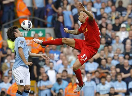 Liverpool's Jonjo Shelvey (R) is challenged by Manchester City's David Silva during their English Premier League soccer match at Anfield in Liverpool's Jonjo Shelvey (R) is challenged by Manchester City's David Silva during their English Premier League soccer match at Anfield in