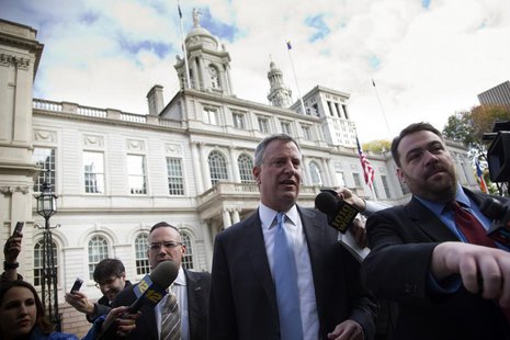 Incoming New York City Mayor Bill de Blasio exits City Hall after meeting with Mayor Michael Bloomberg in New York November 6, 2013. REUTERS Incoming New York City Mayor Bill de Blasio exits City Hall after meeting with Mayor Michael Bloomberg in New York November 6, 2013. REUTERS