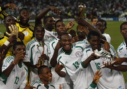 Nigeria's team players celebrate winning their U-17 World Cup UAE final soccer match against Mexico at Mohammed Bin Zayed Stadium in Abu Dha Nigeria's team players celebrate winning their U-17 World Cup UAE final soccer match against Mexico at Mohammed Bin Zayed Stadium in Abu Dha