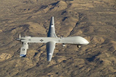 A U.S. Air Force MQ-1 Predator unmanned aerial vehicle assigned to the California Air National Guard's 163rd Reconnaissance Wing flies near A U.S. Air Force MQ-1 Predator unmanned aerial vehicle assigned to the California Air National Guard's 163rd Reconnaissance Wing flies near