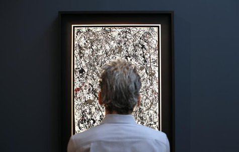 A visitor views American painter Jackson Pollock's 'Number 19,' oil and enamel on paper laid down on canvas, 1948 and estimated between $25- A visitor views American painter Jackson Pollock's 'Number 19,' oil and enamel on paper laid down on canvas, 1948 and estimated between $25-
