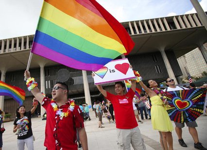 Same sex marriage supporters Lance Namihara (L), Calvin Marquez (C) and Aleeciya Parker rally at the Hawaii State Capital as the State Legis Same sex marriage supporters Lance Namihara (L), Calvin Marquez (C) and Aleeciya Parker rally at the Hawaii State Capital as the State Legis