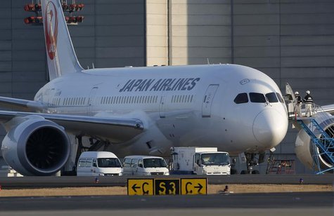 Staff of Japan Airlines' (JAL) enter the company's Boeing Co's 787 Dreamliner plane at New Tokyo international airport in Narita, east of To Staff of Japan Airlines' (JAL) enter the company's Boeing Co's 787 Dreamliner plane at New Tokyo international airport in Narita, east of To