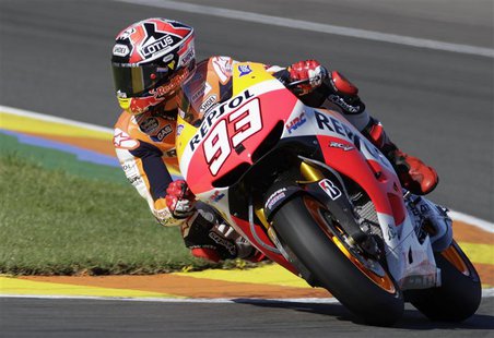 Honda MotoGP rider Marc Marquez of Spain races to win the pole position during the qualifying session ahead of the Valencia Motorcycle Grand Honda MotoGP rider Marc Marquez of Spain races to win the pole position during the qualifying session ahead of the Valencia Motorcycle Grand