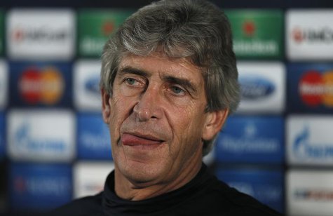 Manchester City's manager Manuel Pellegrini listens to questions during a news conference at the club's Carrington training complex in Manch Manchester City's manager Manuel Pellegrini listens to questions during a news conference at the club's Carrington training complex in Manch
