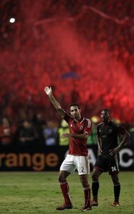 Mohamed Aboutrika of Egypt's Al-Ahli waves to fans after he was substituted during their African Champions League final soccer match against Mohamed Aboutrika of Egypt's Al-Ahli waves to fans after he was substituted during their African Champions League final soccer match against