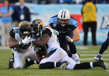 Nov 10, 2013; Nashville, TN, USA; Jacksonville Jaguars safety Johnathan Cyprien (37) recovers an onside kick against the Tennessee Titans du Nov 10, 2013; Nashville, TN, USA; Jacksonville Jaguars safety Johnathan Cyprien (37) recovers an onside kick against the Tennessee Titans du