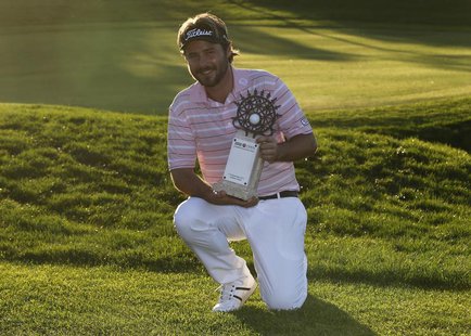 Victor Dubuisson of France poses with his trophy after his victory at the inaugural Turkish Airlines Open in the south west city of Antalya Victor Dubuisson of France poses with his trophy after his victory at the inaugural Turkish Airlines Open in the south west city of Antalya