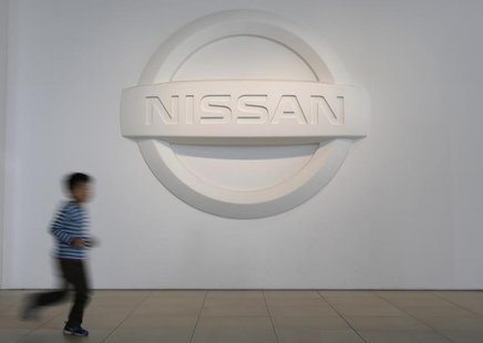 A visitor runs past the logo of Nissan Motor Co at the company's showroom in Yokohama, south of Tokyo November 1, 2013. REUTERS/Yuya Shino A visitor runs past the logo of Nissan Motor Co at the company's showroom in Yokohama, south of Tokyo November 1, 2013. REUTERS/Yuya Shino