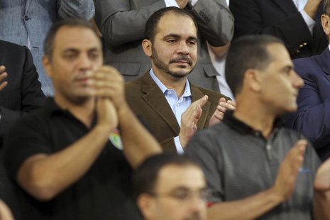 Jordan's Prince Ali bin Al-Hussein (C) attends Jordan's 2014 World Cup qualifying soccer match against Uzbekistan at King Abdullah stadium i Jordan's Prince Ali bin Al-Hussein (C) attends Jordan's 2014 World Cup qualifying soccer match against Uzbekistan at King Abdullah stadium i