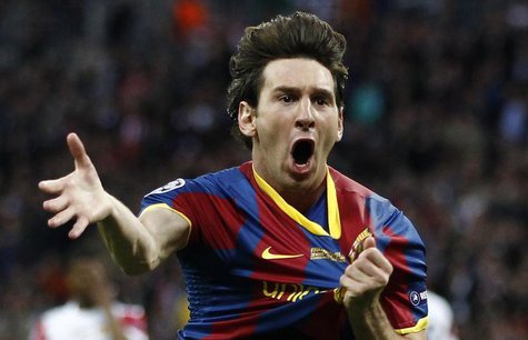 Barcelona's Lionel Messi celebrates after scoring against Manchester United during their Champions League final soccer match at Wembley Stad Barcelona's Lionel Messi celebrates after scoring against Manchester United during their Champions League final soccer match at Wembley Stad