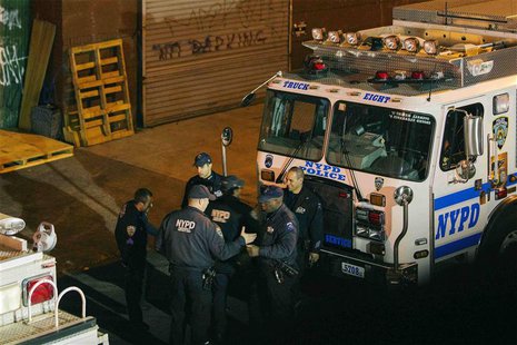 New York Police Department Officers depart a multiple shooting crime scene on Maujer Street in the Brooklyn borough of New York, November 11 New York Police Department Officers depart a multiple shooting crime scene on Maujer Street in the Brooklyn borough of New York, November 11