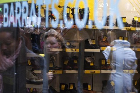 Passers-by are reflected in the display window of Barratts shoe shop on Oxford Street in central London, December 8, 2011. REUTERS/Finbarr O Passers-by are reflected in the display window of Barratts shoe shop on Oxford Street in central London, December 8, 2011. REUTERS/Finbarr O