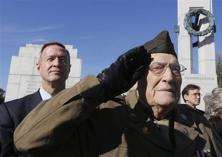 World War Two veteran Anthony Gizzi, 90, of Haverstraw, New York, salutes next to Maryland Governor Martin O'Malley (L) while honoring his f World War Two veteran Anthony Gizzi, 90, of Haverstraw, New York, salutes next to Maryland Governor Martin O'Malley (L) while honoring his f