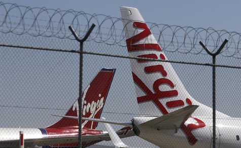 Virgin planes are parked next to each other at Kingsford Smith airport in Sydney August 30, 2013. REUTERS/Daniel Munoz Virgin planes are parked next to each other at Kingsford Smith airport in Sydney August 30, 2013. REUTERS/Daniel Munoz