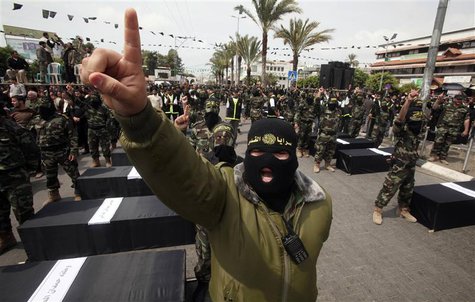 Islamic Jihad militants take part in a rally calling for the Arab League to cancel an initiative for peace with Israel, in Gaza City in this Islamic Jihad militants take part in a rally calling for the Arab League to cancel an initiative for peace with Israel, in Gaza City in this
