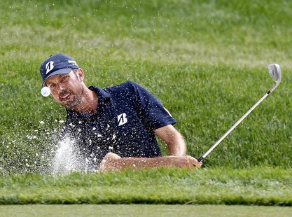 Matt Kuchar of the U.S. hits from the sand on the 16th hole during the third round of the Memorial Tournament at Muirfield Village Golf Club Matt Kuchar of the U.S. hits from the sand on the 16th hole during the third round of the Memorial Tournament at Muirfield Village Golf Club