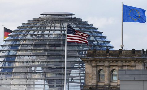 The flag on the U.S. embassy is pictured next to the Reichstag building, seat of the German lower house of parliament Bundestag, in Berlin O The flag on the U.S. embassy is pictured next to the Reichstag building, seat of the German lower house of parliament Bundestag, in Berlin O