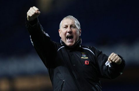 Inverness Caledonian Thistle manager Terry Butcher celebrates after their Scottish League Cup soccer match victory over Rangers at Ibrox Sta Inverness Caledonian Thistle manager Terry Butcher celebrates after their Scottish League Cup soccer match victory over Rangers at Ibrox Sta