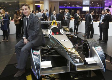 Alejandro Agag, CEO of Formula E Holdings, poses for a photograph with the Formula E car on display in London November 12, 2013. REUTERS/Luk Alejandro Agag, CEO of Formula E Holdings, poses for a photograph with the Formula E car on display in London November 12, 2013. REUTERS/Luk
