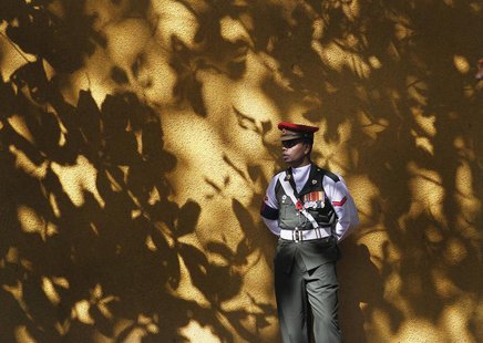 A soldier on duty looks on as he stands guard at an entrance at the World World II war memorial during an event marking Remembrance Day, als A soldier on duty looks on as he stands guard at an entrance at the World World II war memorial during an event marking Remembrance Day, als