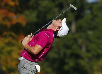 Team Europe golfer Rory McIlroy of Northern Ireland bends backwards as he misses a birdie putt to halve the seventh hole during the morning Team Europe golfer Rory McIlroy of Northern Ireland bends backwards as he misses a birdie putt to halve the seventh hole during the morning