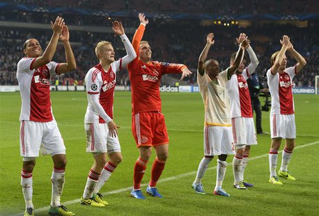 Ajax Amsterdam's players celebrate their victory against Celtic after their Champions League soccer match at Amsterdam Arena November 6, 201 Ajax Amsterdam's players celebrate their victory against Celtic after their Champions League soccer match at Amsterdam Arena November 6, 201