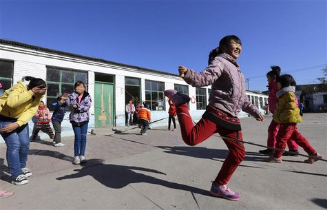 Students play a rope-skipping game during a break at Pengying School on the outskirts of Beijing November 11, 2013. REUTERS/Jason Lee Students play a rope-skipping game during a break at Pengying School on the outskirts of Beijing November 11, 2013. REUTERS/Jason Lee