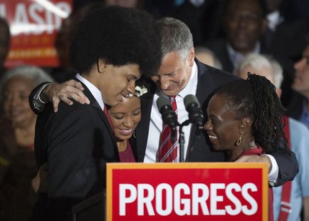 Liberal Democrat Bill de Blasio (2nd R) hugs his wife Chirlane (R) and children Chiara and Dante during his election victory party at the Pa Liberal Democrat Bill de Blasio (2nd R) hugs his wife Chirlane (R) and children Chiara and Dante during his election victory party at the Pa