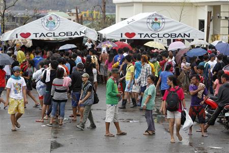 Residents gather to make free calls to their relatives after Typhoon Haiyan devastated Tacloban city, central Philippines November 12, 2013. CREDIT: REUTERS/ROMEO RANOCO Residents gather to make free calls to their relatives after Typhoon Haiyan devastated Tacloban city, central Philippines November 12, 2013. CREDIT: REUTERS/ROMEO RANOCO