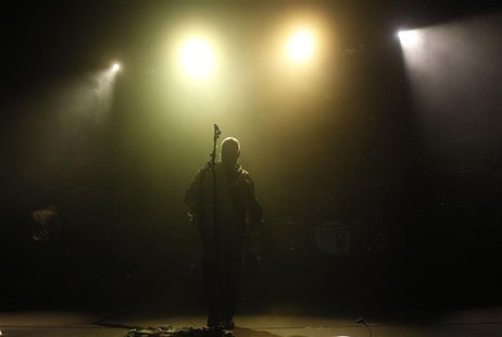 Black Francis of the American band the Pixies stands under stage lights during a performance at Lisbon Coliseum November 9, 2013. REUTERS/Hu Black Francis of the American band the Pixies stands under stage lights during a performance at Lisbon Coliseum November 9, 2013. REUTERS/Hu