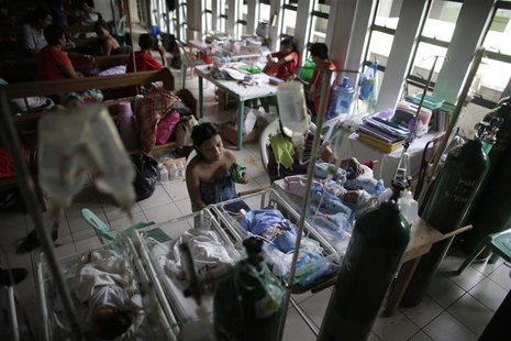 Newborn babies lie in cribs inside a chapel which was turned into a makeshift hospital after Super Typhoon Haiyan battered Tacloban city in Newborn babies lie in cribs inside a chapel which was turned into a makeshift hospital after Super Typhoon Haiyan battered Tacloban city in