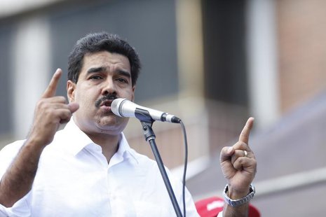 Venezuelan President Nicolas Maduro talks to supporters during a meeting outside Miraflores Palace in Caracas November 12, 2013. REUTERS/Car Venezuelan President Nicolas Maduro talks to supporters during a meeting outside Miraflores Palace in Caracas November 12, 2013. REUTERS/Car